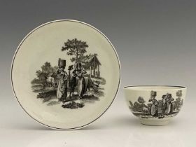 A Worcester black and white printed tea bowl and saucer, circa 1765, printed with the Milkmaid
