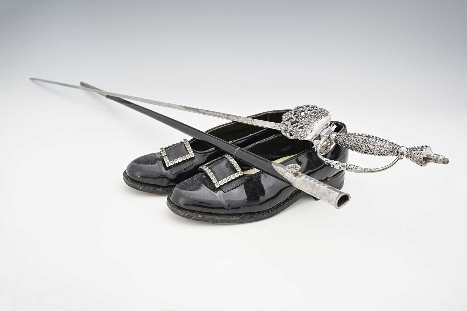 A court sword and patent leather dress shoes of a High Sheriff, the steel blade marked for Hammond