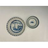 A London Delft blue and white dish and bowl, the large shallow dish painted with weeping willow