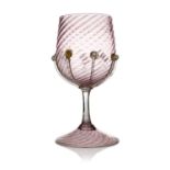 Antonio Salviati, a Venetian Murano glass goblet, pink mottled wrythen moulded with applied