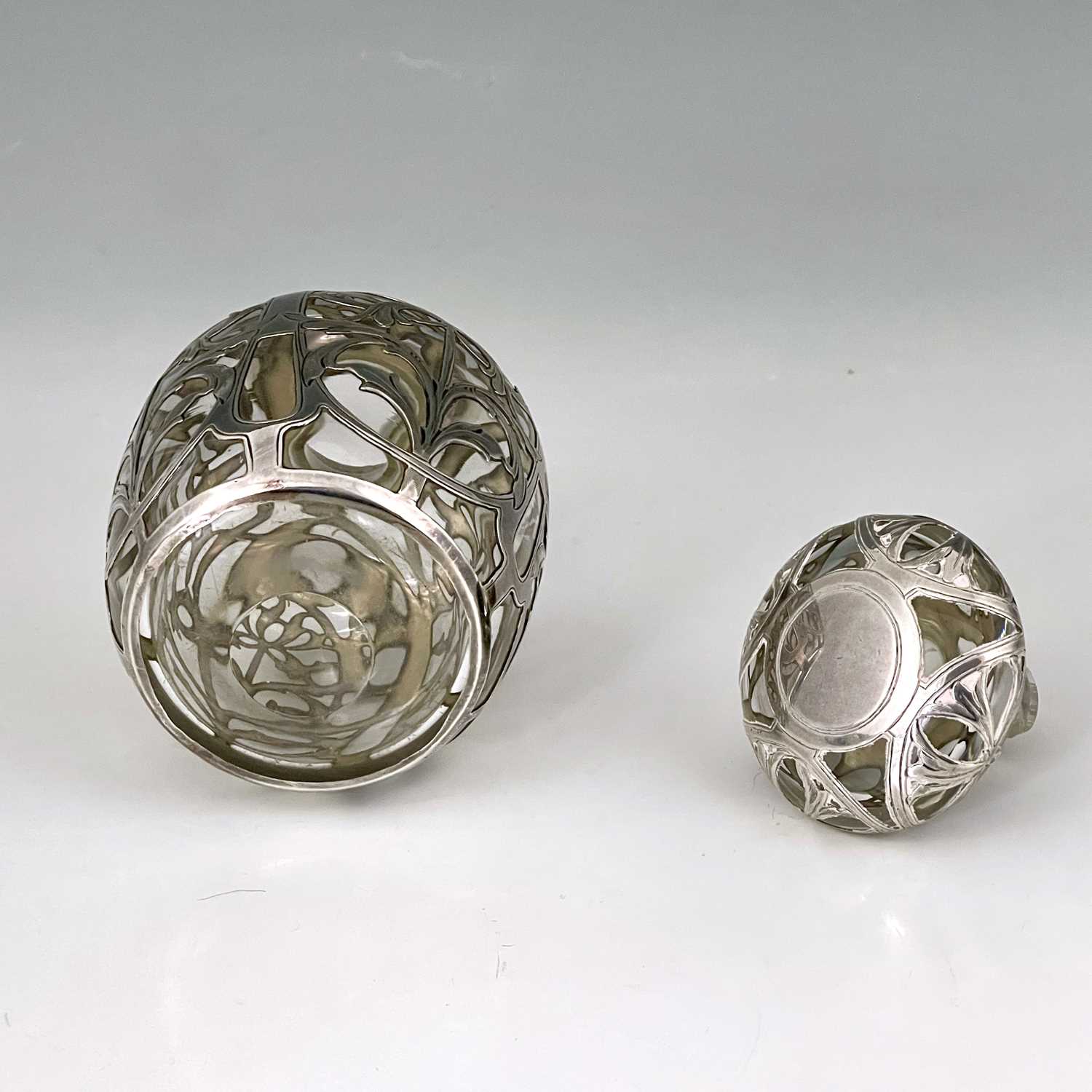 An American Art Nouveau silver overlay glass perfume bottle and stopper, ovoid form, chased with - Image 5 of 5