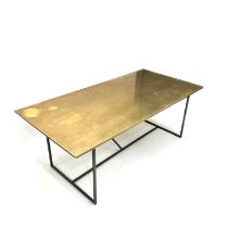 A contemporary Mufti dining table, of industrial design with a patinated brass top and wrought