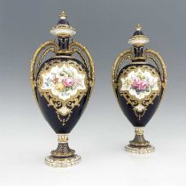 Cuthbert Gresley for Royal Crown Derby, a pair of floral painted twin handled vases and covers,