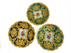 Three 19th century Meissen relief moulded dishes, each with floral cartouches around a central