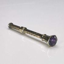 A gold coloured metal and amethyst set propelling pencil, circa 1880, hexagonal section with seal