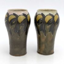 Florrie Jones for Royal Doulton, a pair of stoneware vases, shouldered from with a frieze of