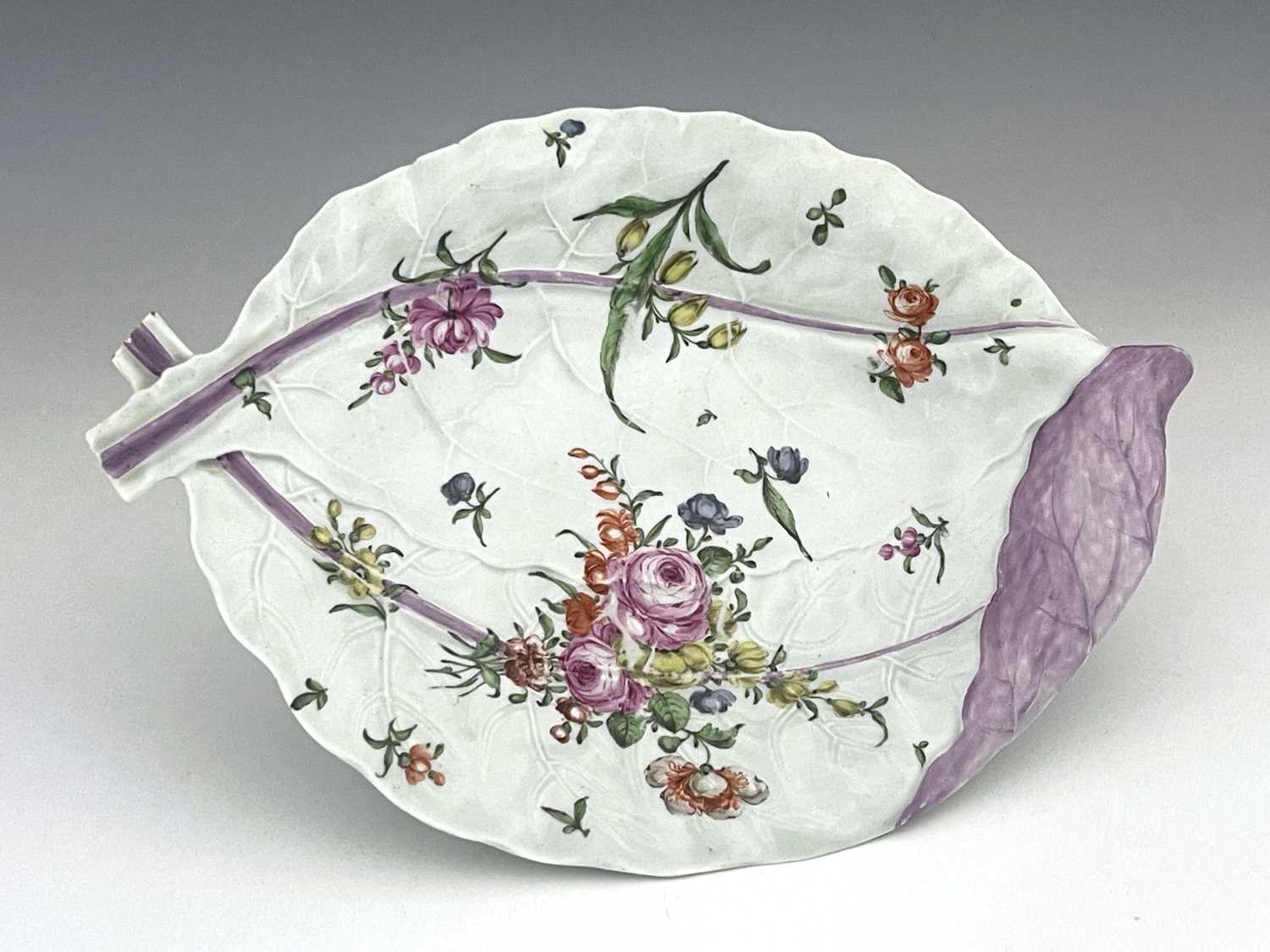 A Worcester polychrome large double leaf dish, circa 1765, relief moulded and painted with floral