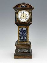 A Doulton stoneware novelty time piece, 1884, modelled as a longcase clock, moulded foliate panels