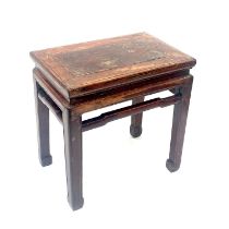 A Chinese stained and lacquered wood low table or stool, probably 19th century or earlier,