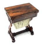 A Regency rosewood work and games table combined, circa 1820, fold-over top with green baize lining,