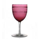 James Powell and Sons, Whitefriars, an Etruscan Revival cranberry and colourless wine glass, circa