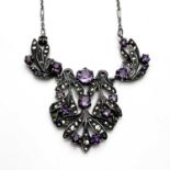 Bernard Instone, an Art Deco silver, marcasite and amethyst necklace, the ope foliate pendant with