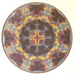 Arts & Crafts School, circa 1900, 'Polychrome', a roundel of stylized foliage, titled below, E.S.K