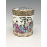 A Chinese famille rose jar and cover or tea caddy, Canton, cylindical form, painted in the round