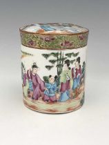 A Chinese famille rose jar and cover or tea caddy, Canton, cylindical form, painted in the round