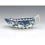 A Worcester blue and white sauce boat, circa 1765-70, reeded form, painted with the Donut pattern to