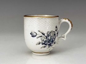 A Bristol porcelain coffee cup, cross mark, circa 1770, rattan moulded border above blue