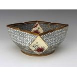 A Doulton and Rix Marqueterie ware bowl, square rim with diamond panel corners painted with