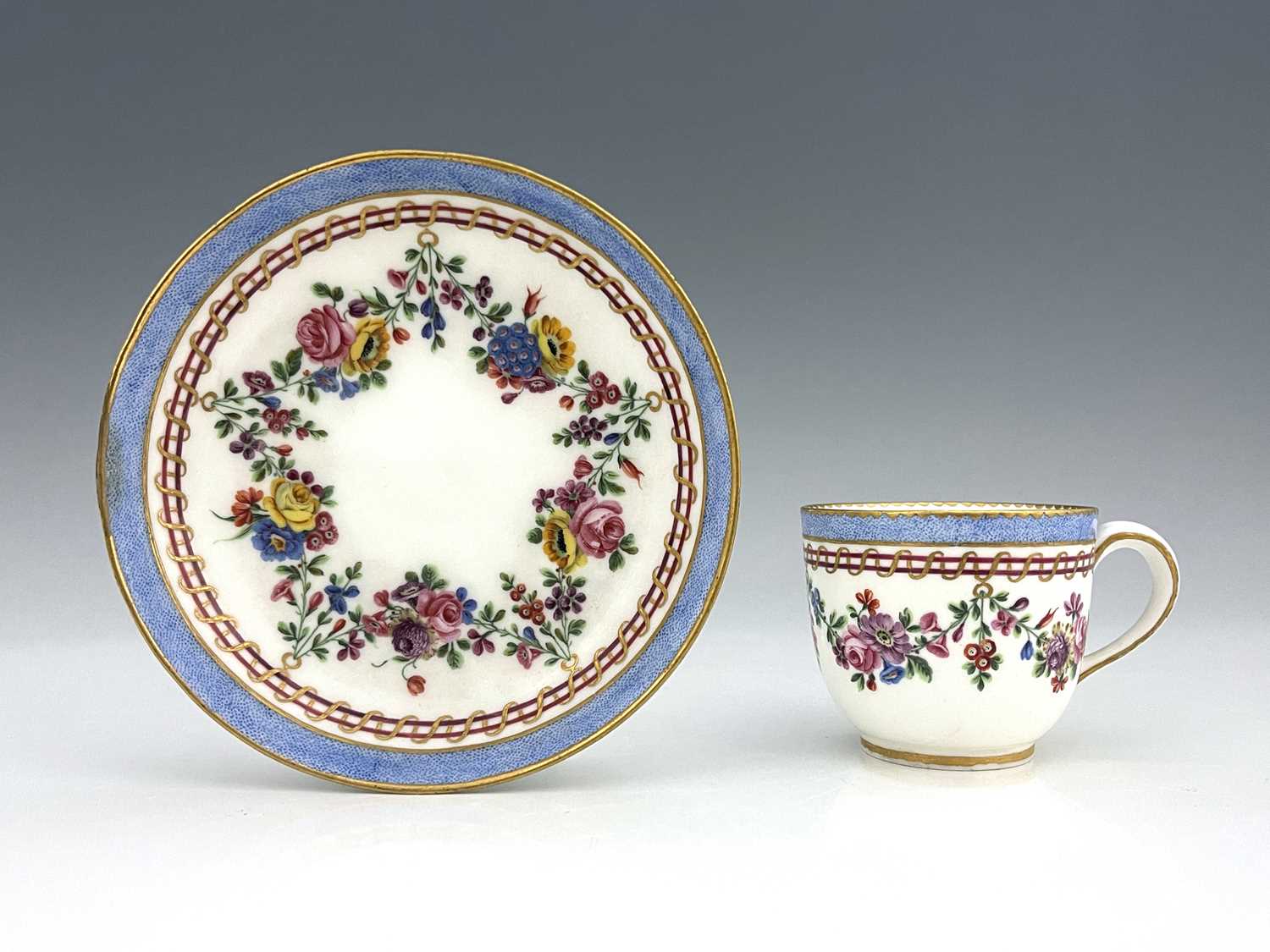 A Sevres porcelain tea cup and saucer, interlace L mark with Q, 1769, gobelet Bouillard form, the