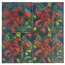 Lewis Foreman Day for Pilkington, a set of four floral tiles, painted with red lilies, on a blue