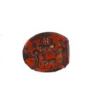 A Roman intaglio, carved with two figures flanking a goat type animal, red hardstone, 1.5cm long