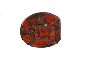 A Roman intaglio, carved with two figures flanking a goat type animal, red hardstone, 1.5cm long