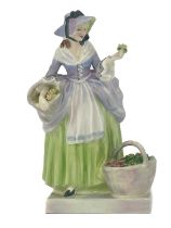 A Royal Doulton figure, Spring Flowers, model HN1807, in a green skirt and purple corset, printed