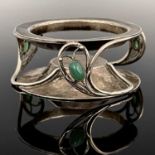 C R Ashbee for the Guild of Handicraft, an Arts and Crafts silver and chrysoprase set salt stand,