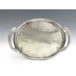 Archibald Knox for Liberty & Co, a Tudric pewter tray, circa 1905, oval form with integral handles