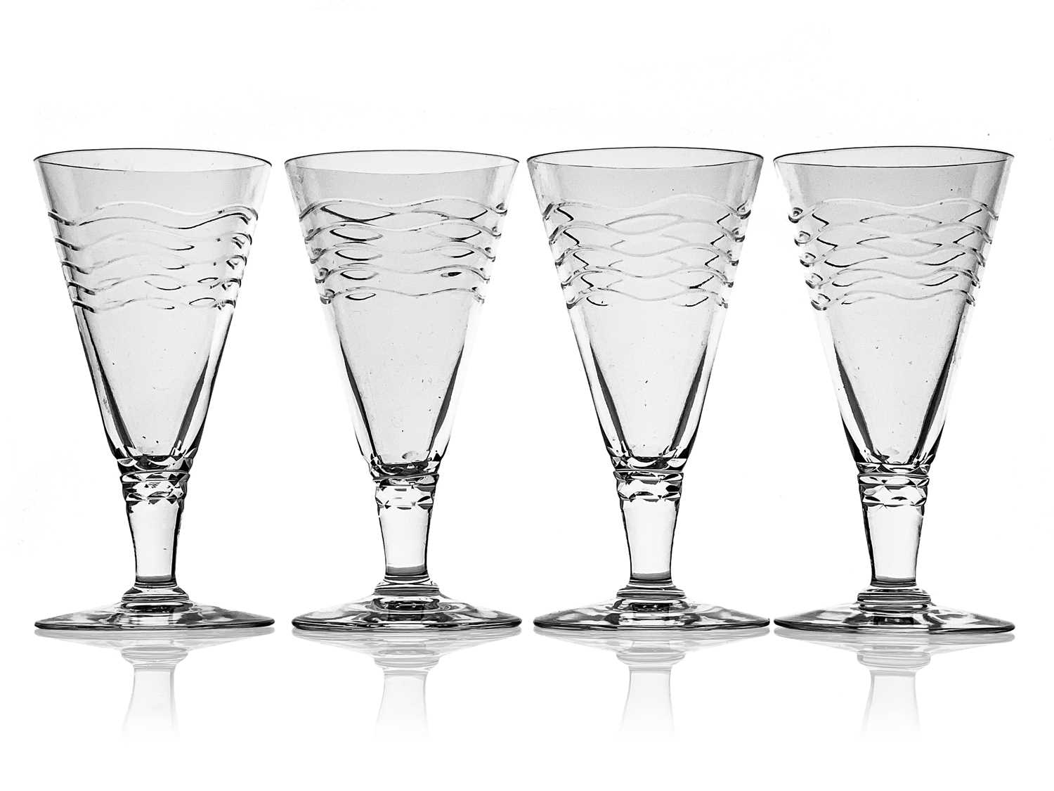 Herbert Webb for Webb Corbett, a set of four Art Deco cut glass drinking glasses, circa 1930,