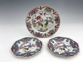 A pair of Chinese famille rose plate and another, two with ogee petal borders, each painted with a