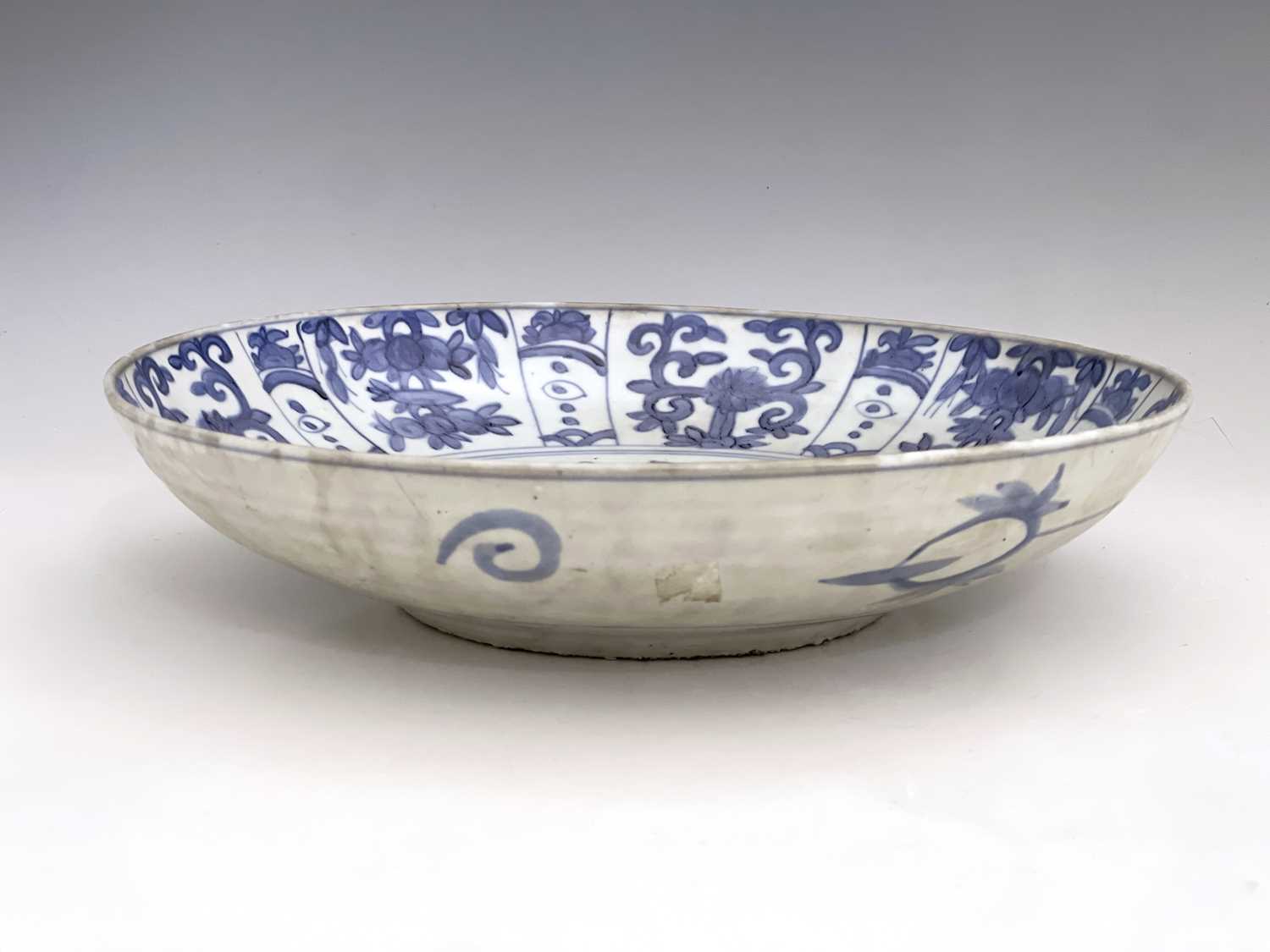 A Chinese blue and white dish, Ming, painted with a bird on rock with peony design, within a - Image 3 of 5