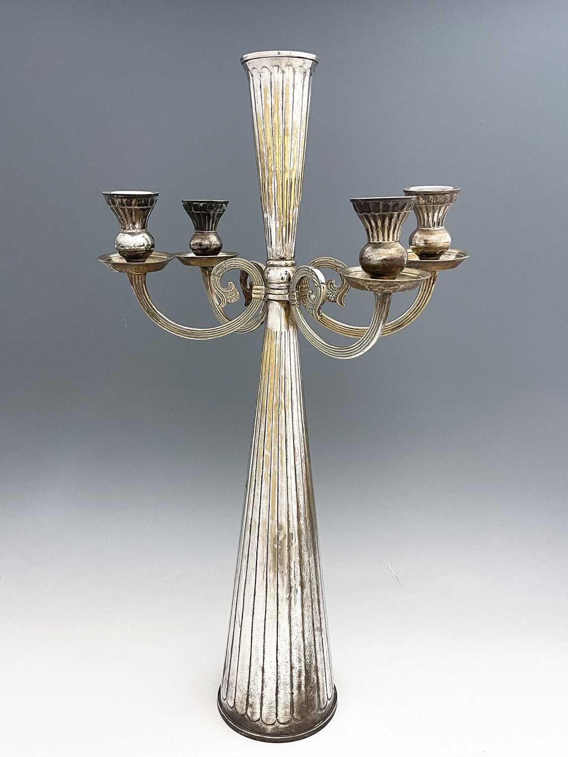 A large Jugendstil silver plated four arm candelabrum, circa 1925, conical form with embossed reeded