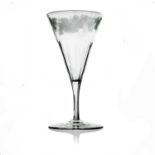 James Powell and Sons, Whitefriars, an etched wine glass, circa 1855, the conical bowl with slice