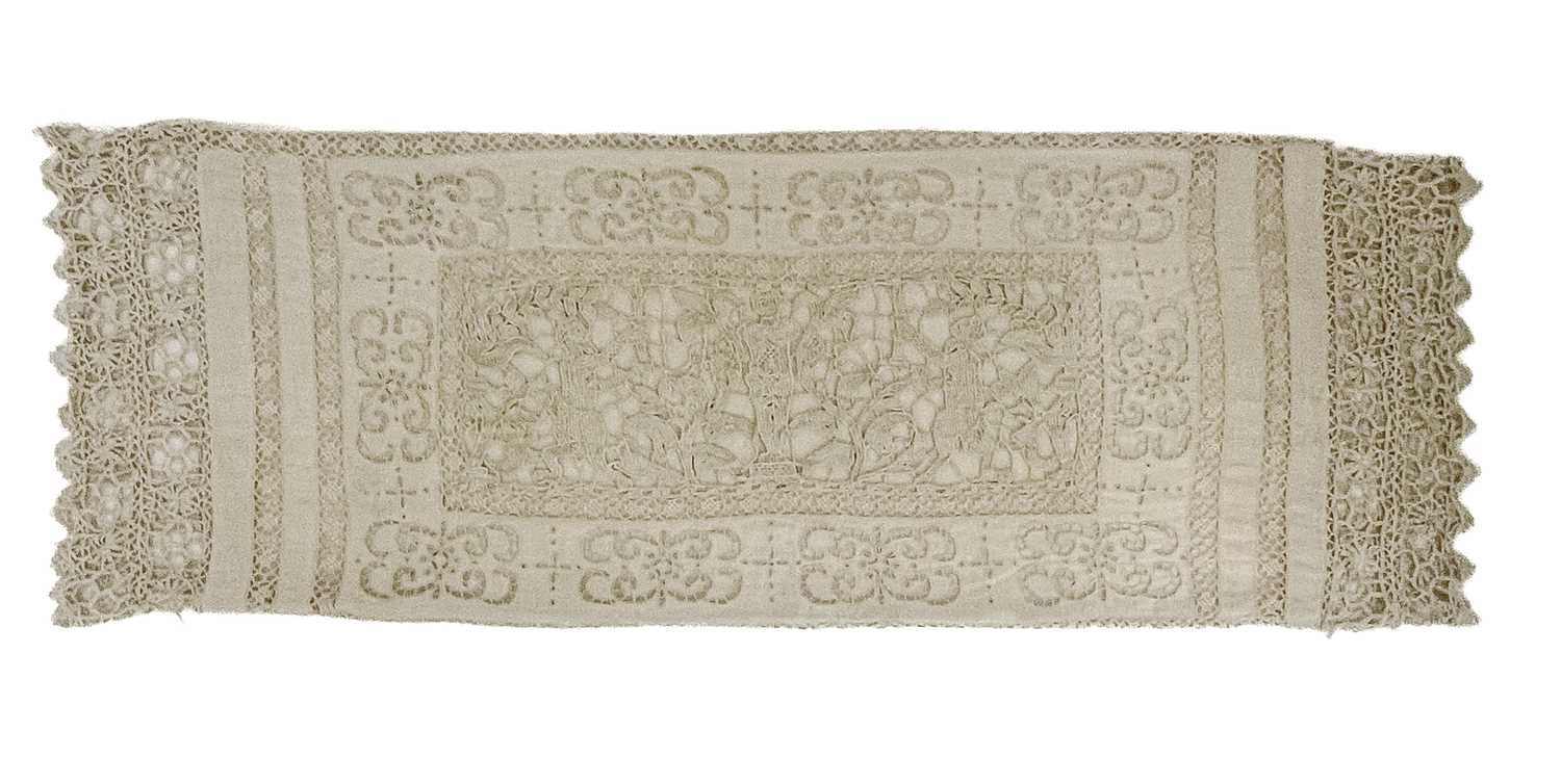 A 17th century style lace pillow case, in the Mannerist style with faun type figures flanking a