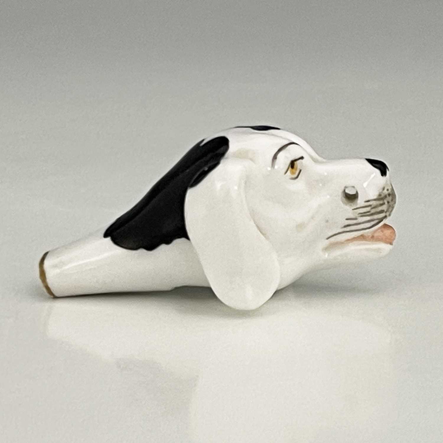 A Staffordshire porcelain novelty dog whistle, 19th century, modelled in the form of a spaniel's