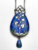 Murrle Bennett and Co., an Arts and Crafts silver and enamelled pendant, the pear form plaque cast