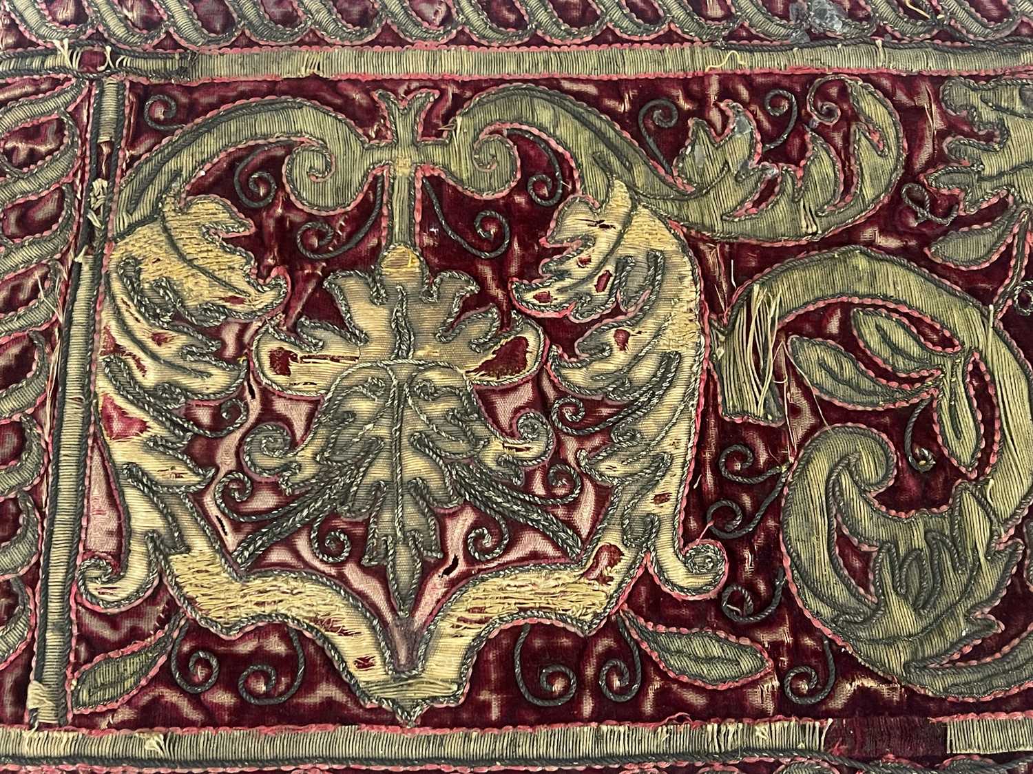 A 17th century gilt embroidered velvet religious hanging, red ground with foliate scroll and - Bild 3 aus 3