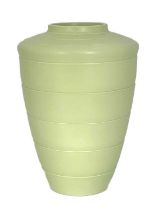 Keith Murray for Wedgwood, an Art Deco lime green vase, circa 1934, shouldered conical form,