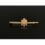 A 9 carat gold and enamelled Roal Army Service Corps bar brooch, applied 8 pointed star on plain