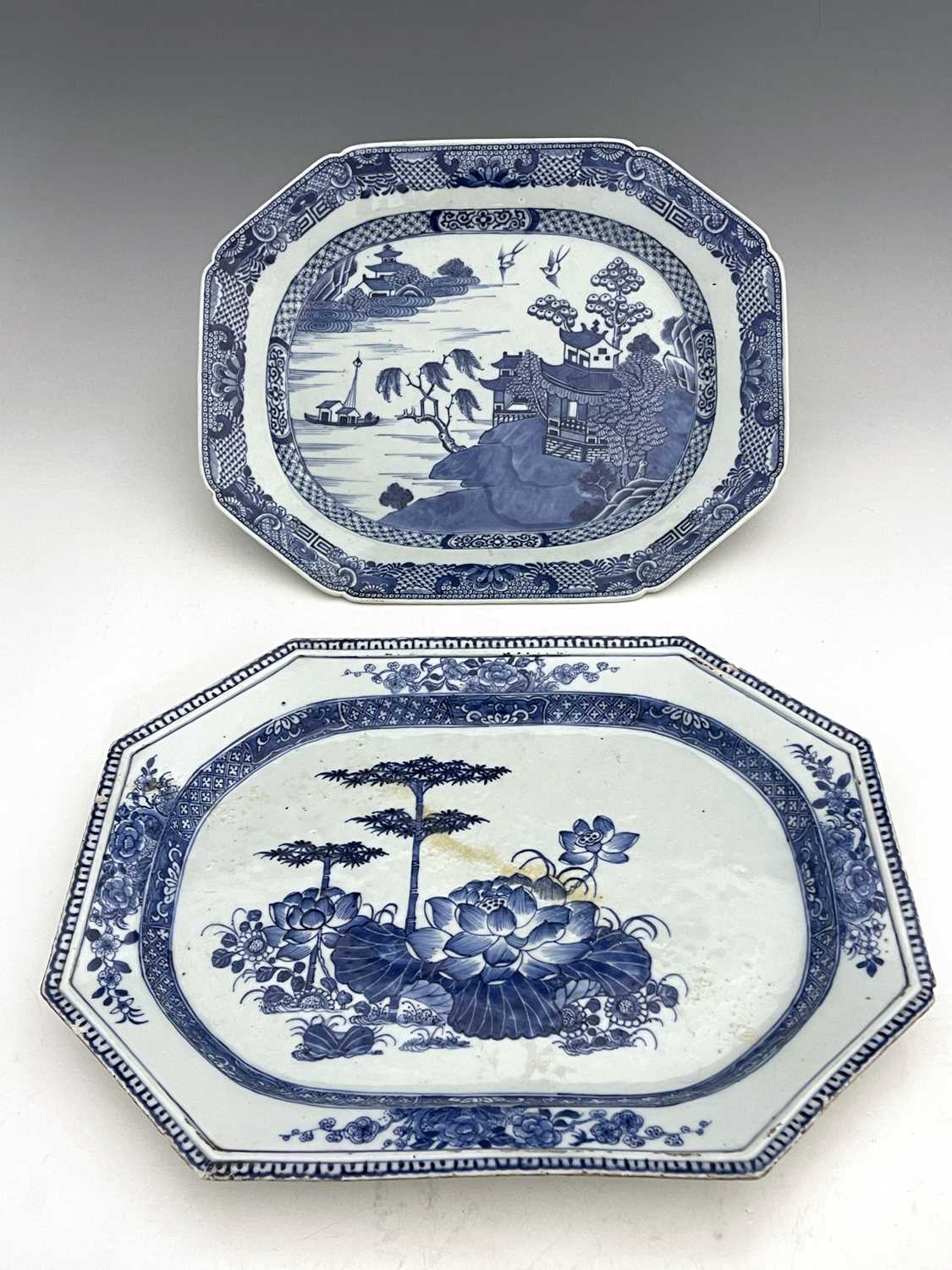 Two Chinese export blue and white platters, each of elongated octagonal form, one with a Willow type