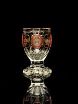 A Bohemian heraldic cameo glass vase, circa 1835, heavy slice cut chalice form with petal base,