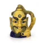 A Royal Doulton limited edition Flambe character jug, Aladdin's Genie, model D6971, yellow glaze,