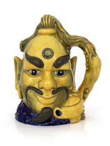 A Royal Doulton limited edition Flambe character jug, Aladdin's Genie, model D6971, yellow glaze,