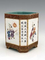 A Chinese famille rose brush pot, Qianlong mark, canted cuboid form with relief moulded bamboo