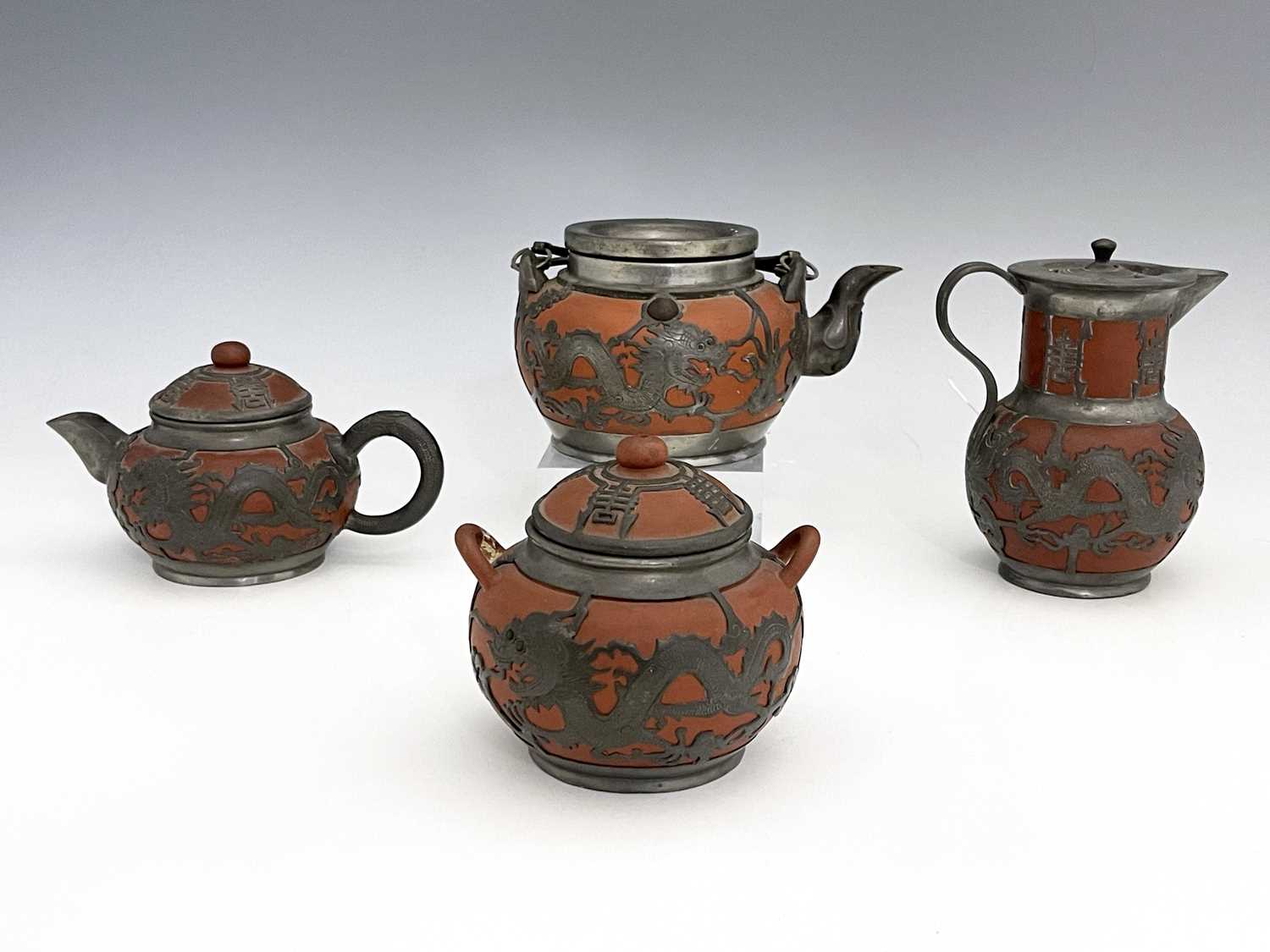 A Chinese Yixing four piece tea set, pewter overlaid redware, chased dragon design below Chinese - Image 3 of 8