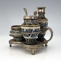 A Doulton Lambeth stoneware three piece cruet in silver plated stand, 1878 ,shouldered form,