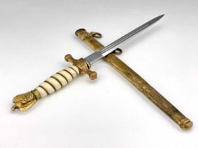 A German Third Reich Naval Officer's dagger, gilt eagle finial, wire-bound white plastic grip,