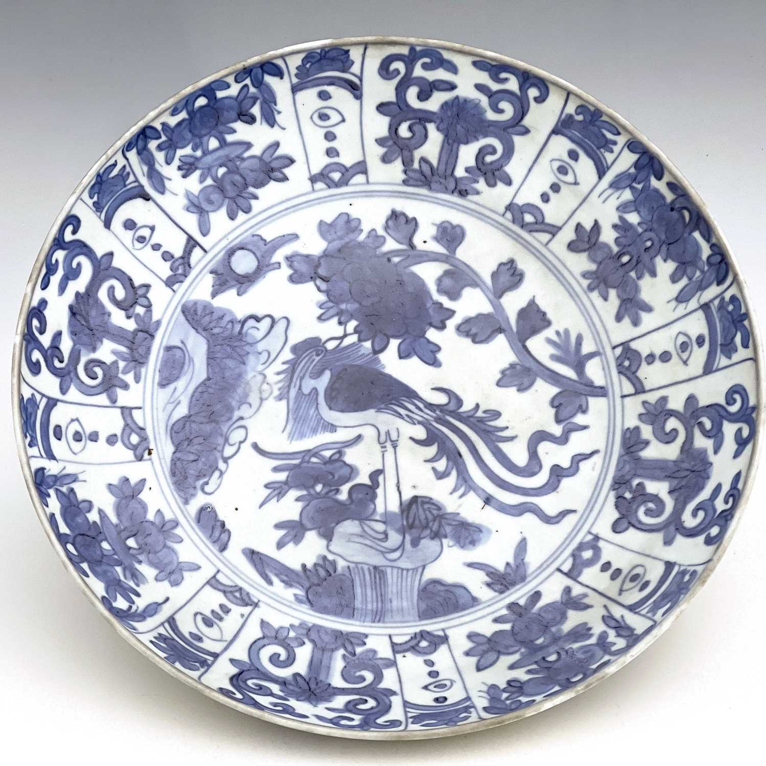 A Chinese blue and white dish, Ming, painted with a bird on rock with peony design, within a - Image 4 of 5