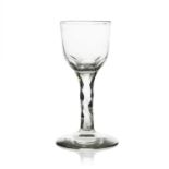 A facet stem wine glass, circa 1790, the ogee bowl on plain cut stem and conical foot, 13.5cm